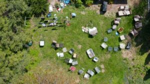 An aerial view of a large yard with numerous items scattered, indicating a cleanout job by Stars Junk Removal in San Jose, CA