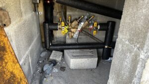 A backflow prevention device and insulated pipes installed by Economy Plumbing Services in Austin, TX