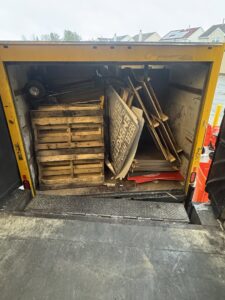 A broken bathtub, drywall sheets, and bags of material outside a house, ready for renovation junk removal by High Speed Junk Removal in Levittown, PA.
