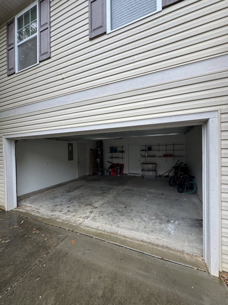 A clean and empty garage after a junk removal service by Junkjet in Charlotte, NC.