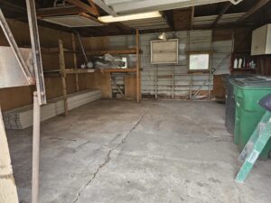 A clean and cleared garage after a junk removal service by 2 Bald Guys Hauling & Junk Removal in San Antonio, TX.