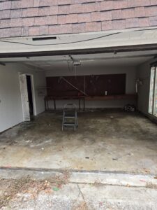 A cleared-out garage, ready for use after a general junk removal service by Clean Tidy Places in Jacksonville, FL.