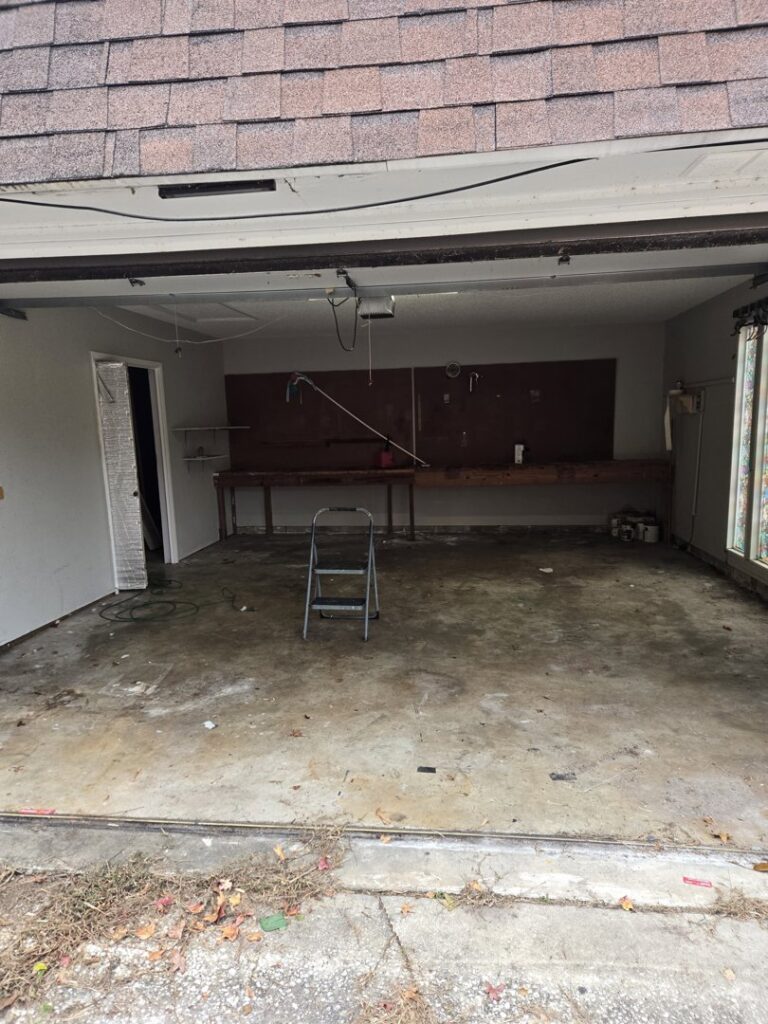 A cleared-out garage, ready for use after a general junk removal service by Clean Tidy Places in Jacksonville, FL.