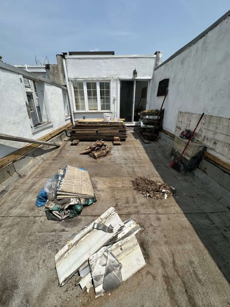 A cluttered bedroom with various items ready for junk removal by We Love Junk in Philadelphia, PA.