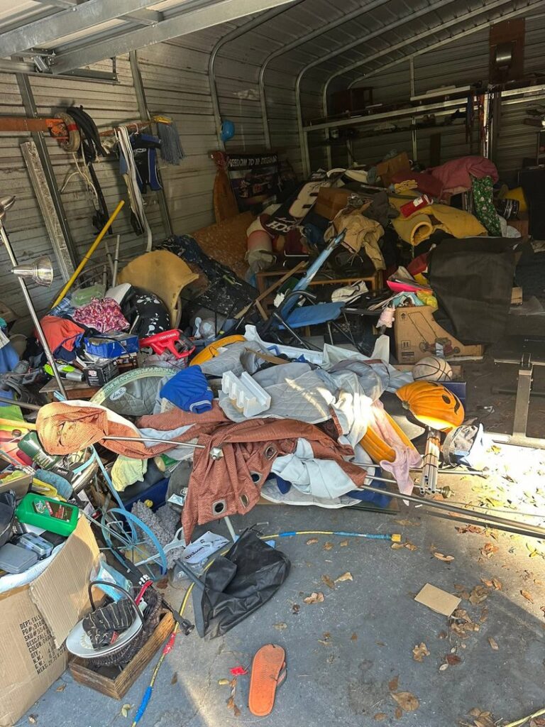 A cluttered garage filled with various items, ready for junk removal by Bring That Junk Removal and Demolition in Jacksonville, FL.