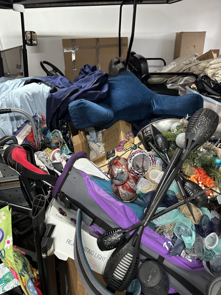 A cluttered garage filled with various items, ready for junk removal by College Hunks in Jacksonville, FL