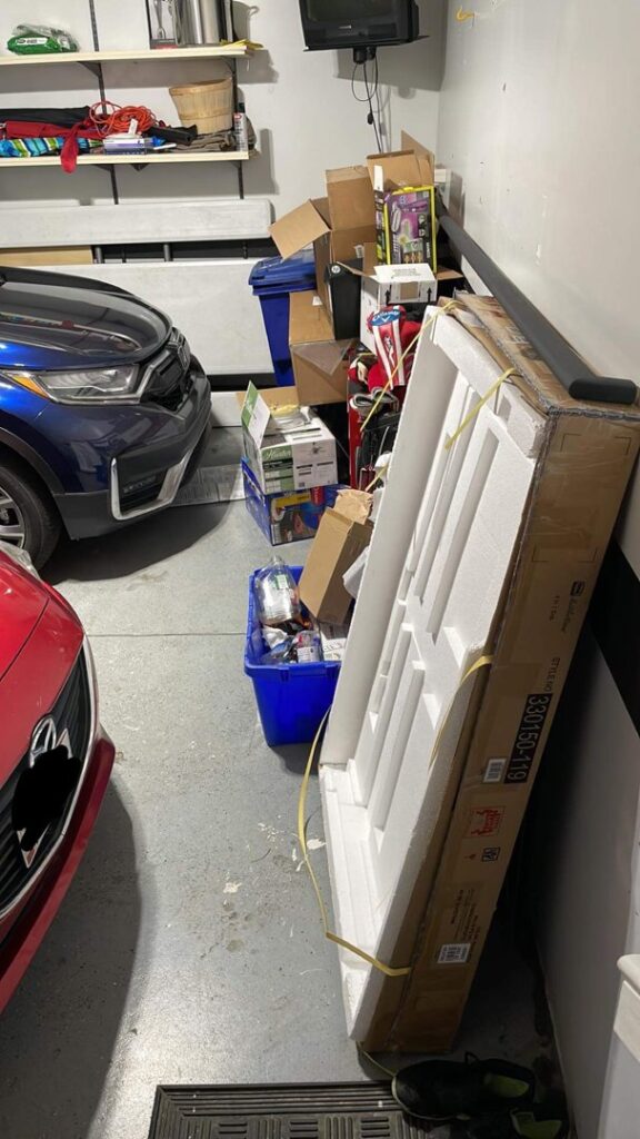 A cluttered garage with boxes and various items awaiting junk removal by JDog Junk Removal & Hauling in Columbus, OH.