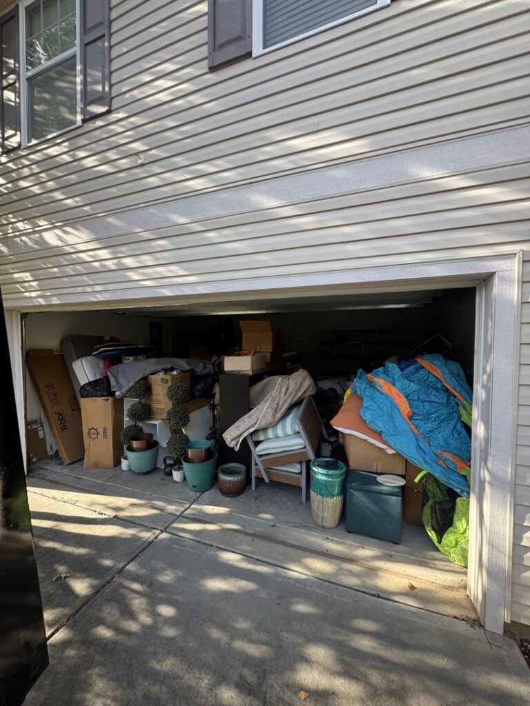 A cluttered garage filled with items awaiting junk removal by Junkjet in Charlotte, NC.