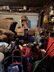 A cluttered garage filled with various items, ready for junk removal by Lolo Hauling Junk Removal in Dallas, TX.