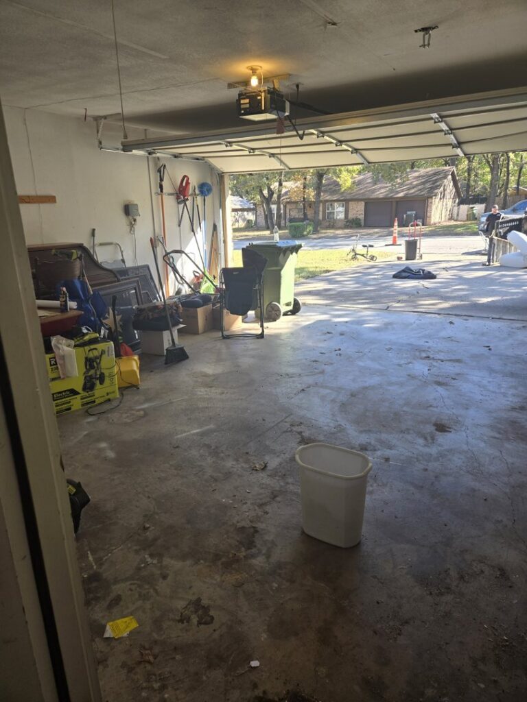 A cluttered garage filled with various items and debris, indicating a need for junk removal from NTX Haul Away Junk Removal in Fort Worth, TX.