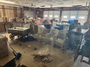 A cluttered garage filled with various items, ready for junk removal by Two Men and a Junk Truck in Columbus, OH.