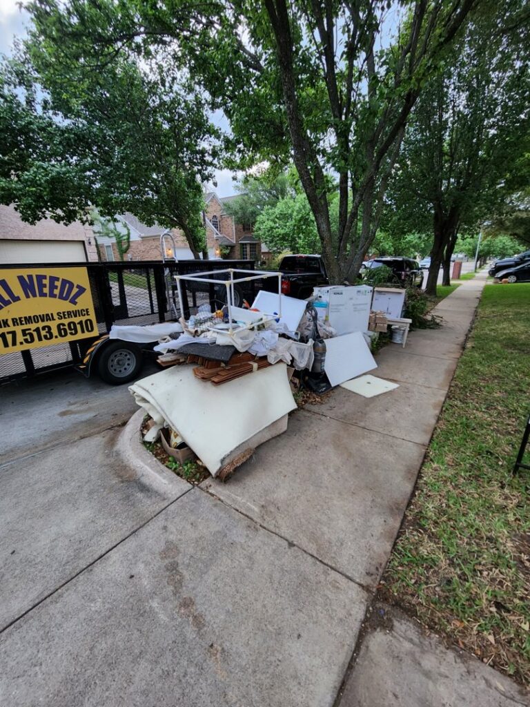 A cluttered indoor space packed with boxes and various items, ready for a cleanout service by All Needz Junk Removal & Hauling Service in Dallas, TX.