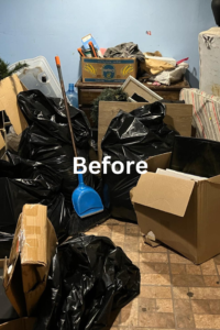 A cluttered room filled with trash bags, boxes, and miscellaneous junk before removal by Grab n Haul Group in Philadelphia, PA.