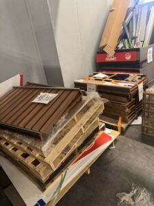 A pile of construction debris, including siding, wood, and boxes, ready for removal by High Speed Junk Removal in Levittown, PA.