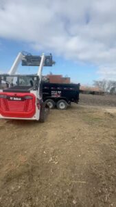 A pile of construction and demolition debris, including wood and other materials, ready for removal by Big Ox Junk Removal in Leander, TX.