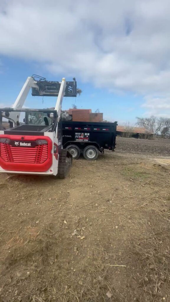 A pile of construction and demolition debris, including wood and other materials, ready for removal by Big Ox Junk Removal in Leander, TX.