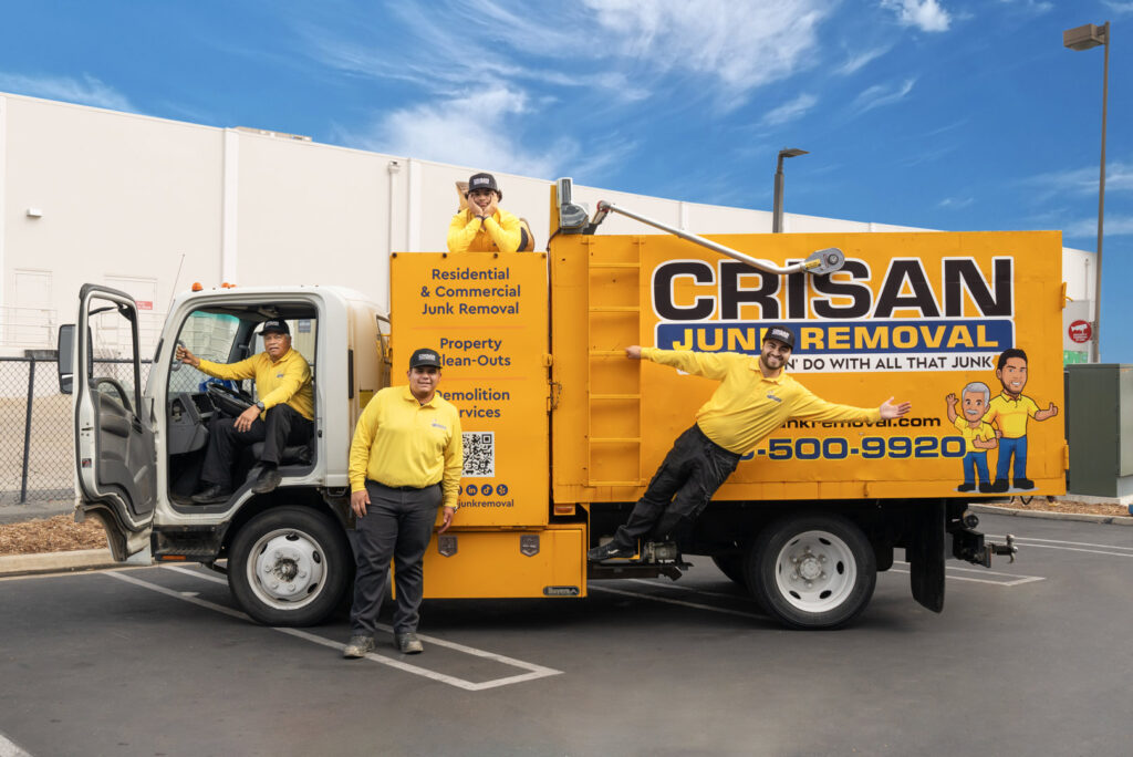 The Crisan Junk Removal team posing with their branded truck, ready for service in San Diego, CA.