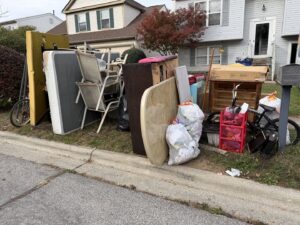 A large pile of household junk on the curb for pickup by We Haul It Cleaning Service LLC in Canal Winchester, OH.