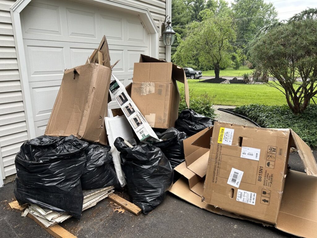 A pile of broken bricks and demolition debris on a wooden deck for junk removal by We Love Junk in Philadelphia, PA.