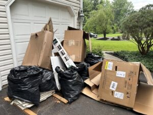A pile of broken bricks and demolition debris on a wooden deck for junk removal by We Love Junk in Philadelphia, PA.