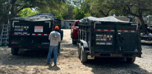 Before and after photos of demolition debris cleanup inside a house by Big Ox Junk Removal in Leander, TX, showing a cleared wall and removed junk.