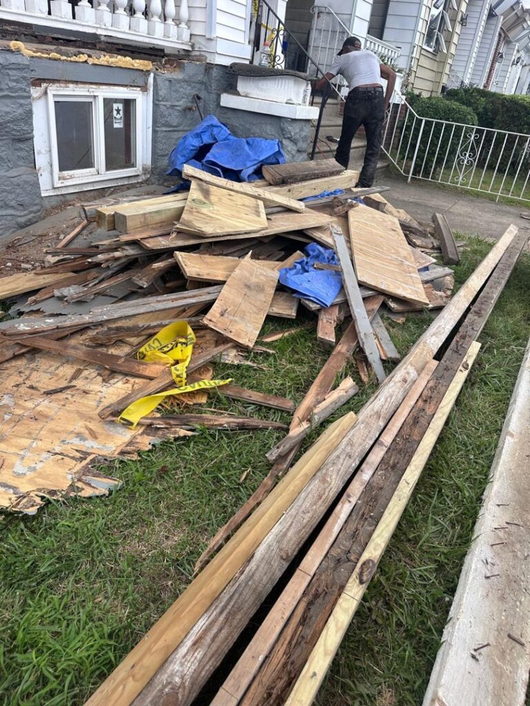 A large pile of demolition wood debris and planks ready for removal by GEF Hauling and Junk Removal in Philadelphia, PA.