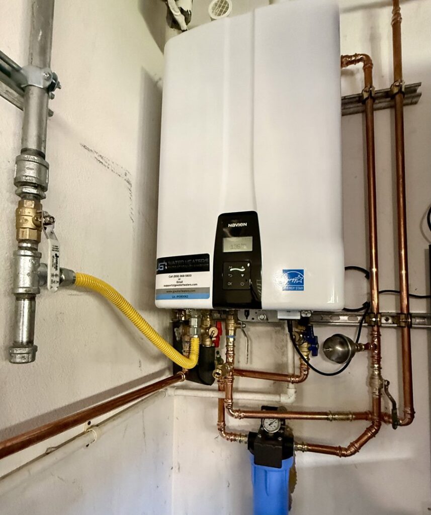 A detailed view of a tankless water heater and water filtration system installation by JG Water Heaters, Filtration and Plumbing in San Diego, CA