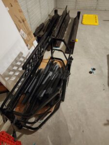 A pile of disassembled metal bed frames and parts ready for junk removal by JDog Junk Removal & Hauling in Columbus, OH.