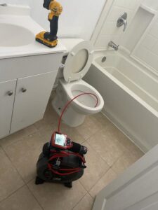 A drain camera being used for a toilet inspection by Plumbing Services Inc. in San Diego, CA.