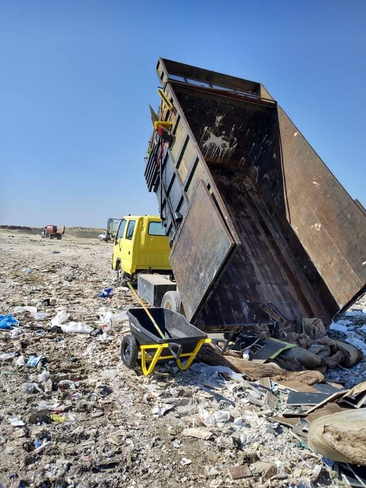 A DonkeyJunk Removal and Home Services dump truck unloading collected junk at a disposal site in Austin, TX