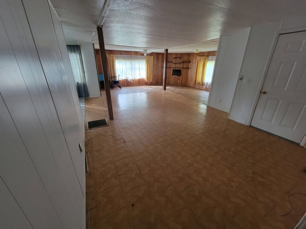 An empty room with tiled flooring after a thorough junk removal and cleanout service by The Mess Haul in Jacksonville, FL.