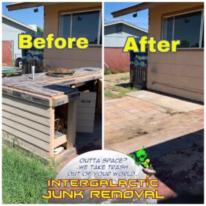 An excavator loading scrap metal into an Intergalactic Junk Removal trailer in Phoenix, AZ, for efficient disposal.