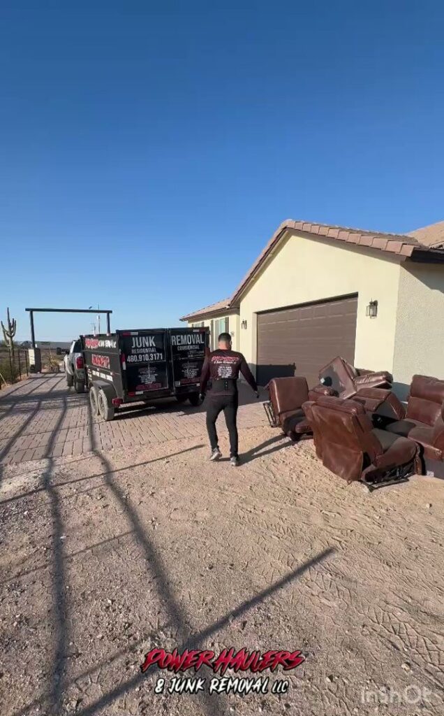 A worker preparing for furniture removal with a trailer from Power Haulers & Junk Removal LLC in Buckeye, AZ.