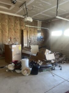 A garage full of boxes and debris, ready for cleanup and removal by Indy Trash Guy in Fortville, IN.
