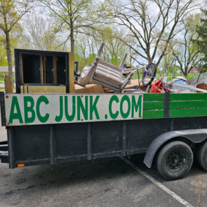 A trailer loaded with various junk items, ready for hauling by ABC Junk Removal & Hauling in Westfield, IN.