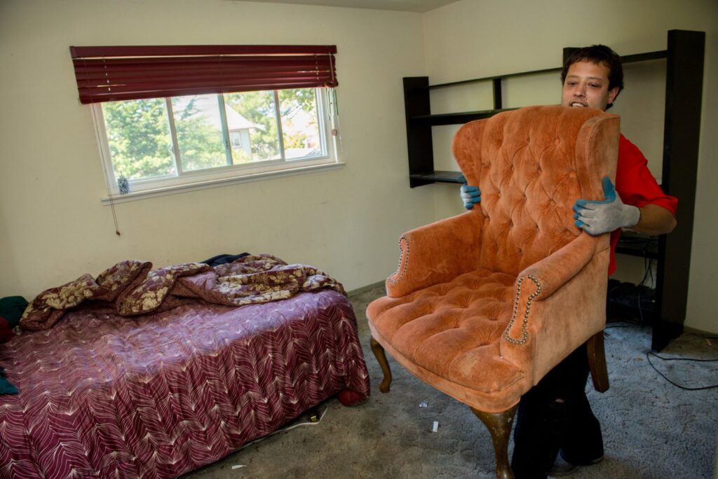A Junk King San Antonio Northwest truck loaded with various items including furniture and boxes after a junk removal job in San Antonio, TX.