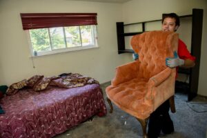 A Junk King San Antonio Northwest truck loaded with various items including furniture and boxes after a junk removal job in San Antonio, TX.
