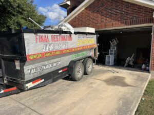 A Final Destination Junk Removal trailer parked in a driveway during a garage cleanout service in San Antonio, TX.