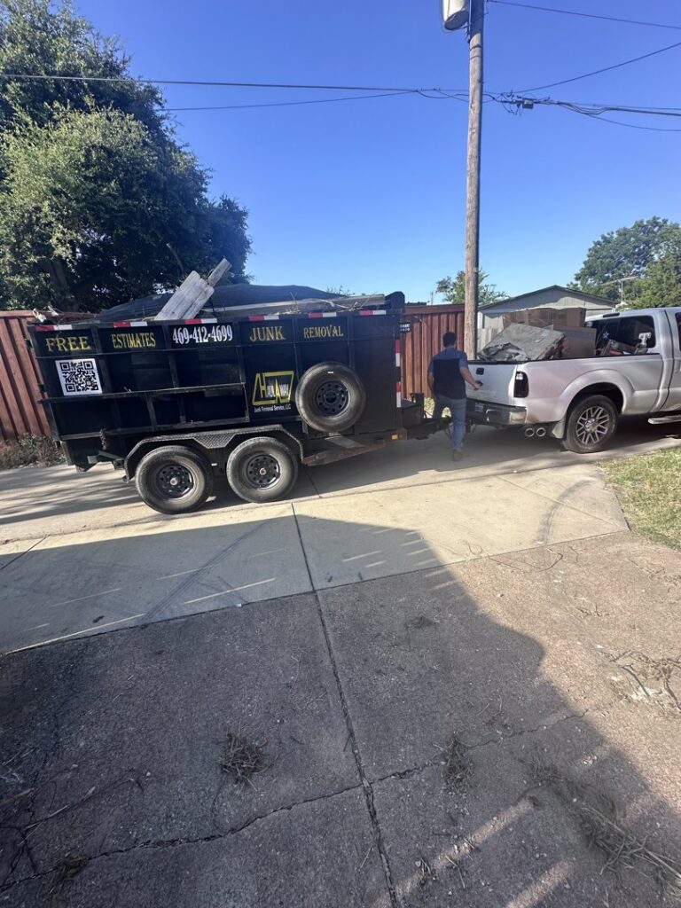 A Haulaway Junk Removal Service, LLC truck and trailer loaded with debris during a junk removal job in Dallas, TX.