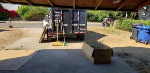 A 24/7 Junk Removal trailer parked for a yard waste pickup job in Rolling Hills Estates, CA.