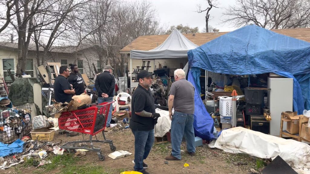 The JunkStart team assessing a heavily cluttered residential property for a large-scale junk removal cleanout in San Antonio, TX.