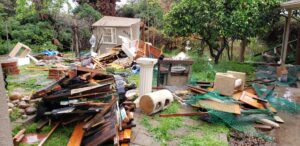 A large pile of backyard junk and debris ready for removal by 24/7 Junk Removal in Rolling Hills Estates, CA.