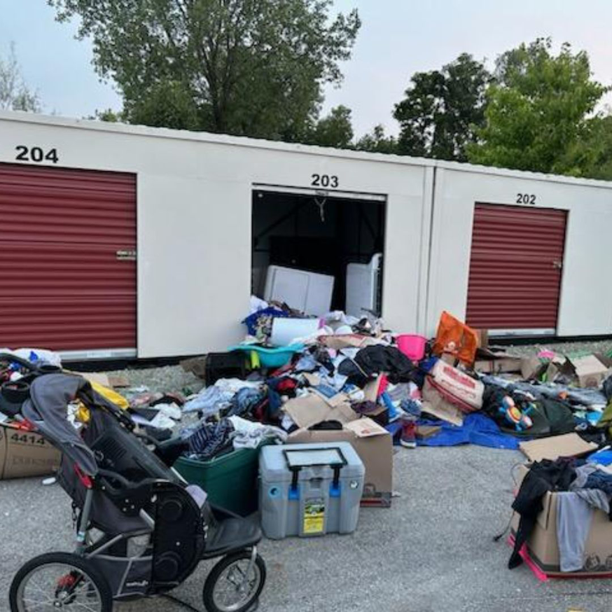 A large pile of household junk and debris outside storage units, ready for removal by ABC Junk Removal & Hauling in Westfield, IN.
