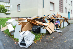 A large pile of various household junk, including furniture and electronics, accumulated outdoors for removal by Zen Junk in San Jose, CA.