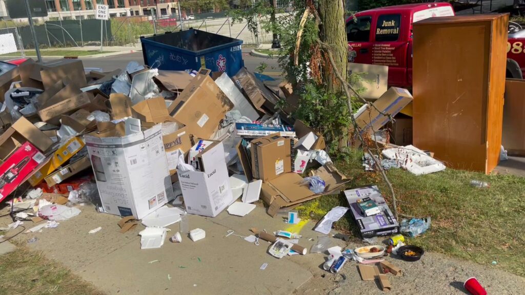 A large pile of household junk and debris on a curb, ready for removal by Junk Fellas LLC in Columbus, OH.