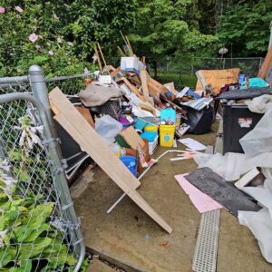 A large pile of various household junk and debris awaiting removal from a residential property by Purefoy's Professionals in Columbus, OH.