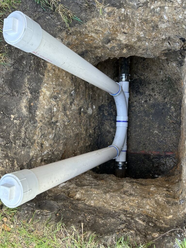 Newly installed PVC pipes for a main water line repair or installation by The Bearded Plumber in San Antonio, TX.