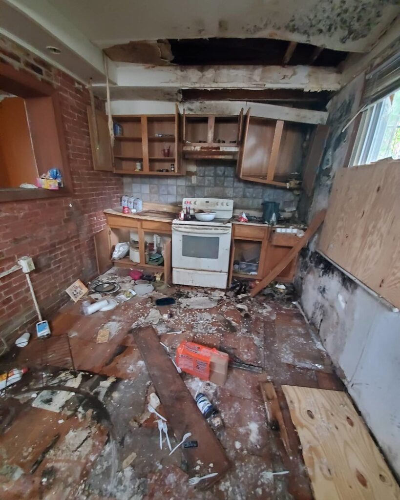 A messy and damaged kitchen requiring a full cleanout service from Space Erasers Junk Removal in Philadelphia, PA