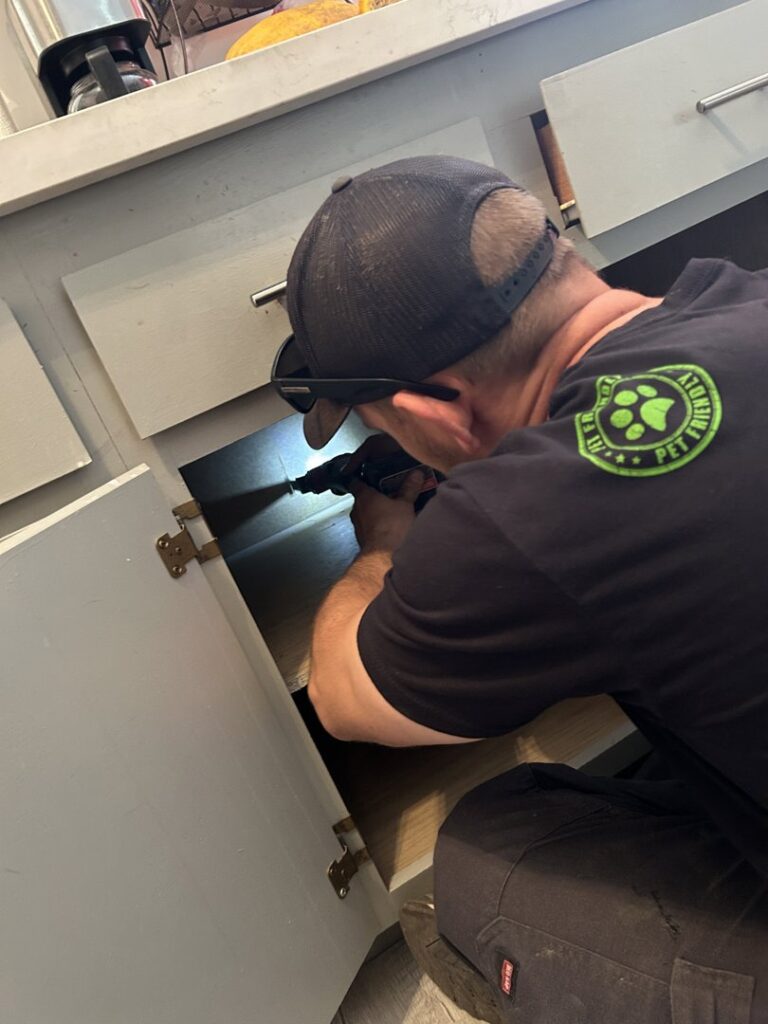 New water filters and their packaging on a driveway, with a JP Plumbing van in the background, ready for installation in Phoenix, AZ