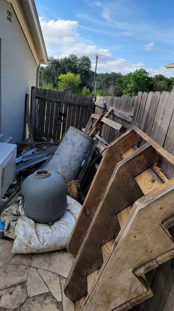 A large pile of various outdoor junk and construction debris ready for removal by Silverhull Junk Removal in San Antonio, TX.